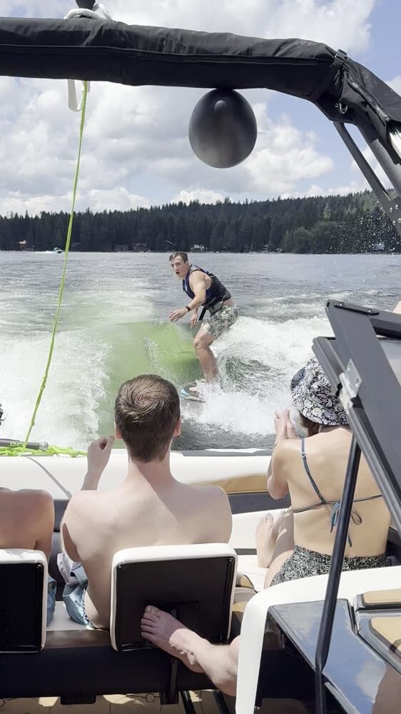 Wakesurfing behind the boat